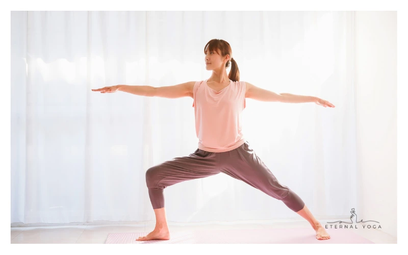 a women doing warrior 2 yoga pose